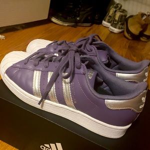 Purple and metallic silver Adidas Superstar shoes